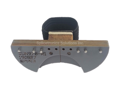 Grey finger jig with placement pins and elastic strap